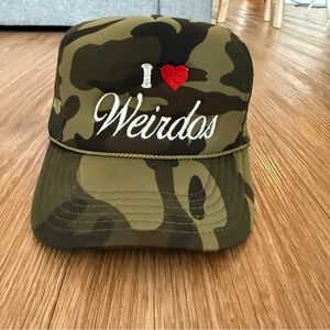 Dressed in LALA Camo 'I ❤️ Weirdos' Trucker Hat
